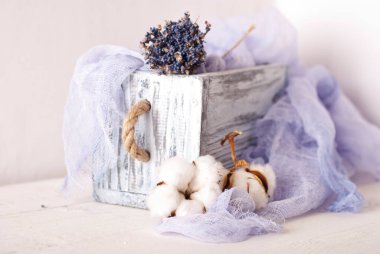 lavender and cotton with violet textile on white wooden table. 