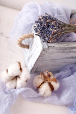 lavender and cotton with violet textile on white wooden table. 