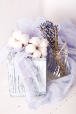 lavender and cotton with violet textile on white wooden table. 
