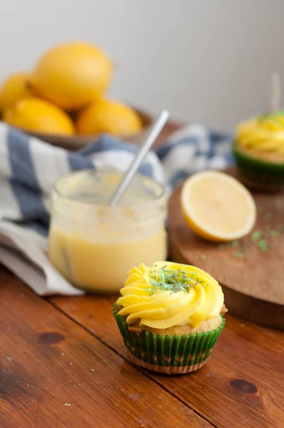 Lemon Homemade Cupcake Yellow Whipped Cream Wooden Table — Zdjęcie stockowe