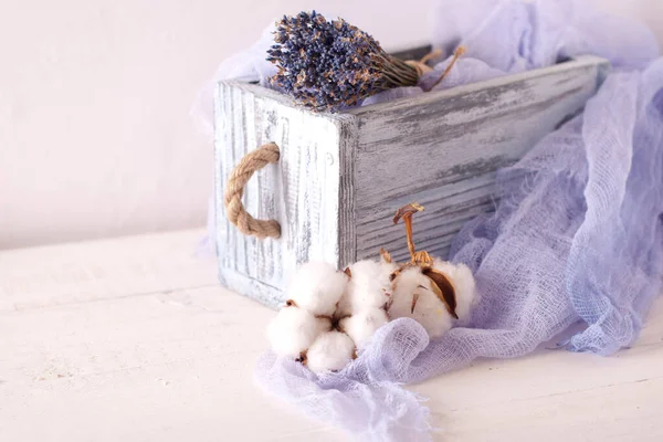 lavender and cotton with violet textile on white wooden table. 