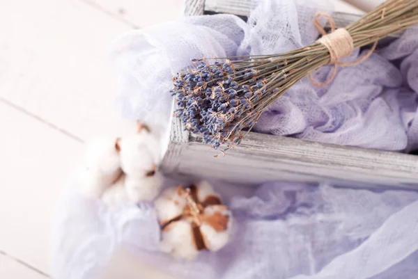 lavender and cotton with violet textile on white wooden table. 
