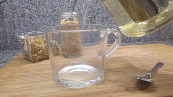 Pour Herbal Tea Cup — стоковое видео