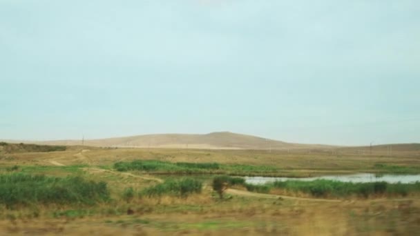 Roadside View Car Fields Lakes Power Lines — Stockvideo