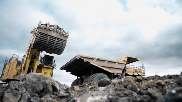 Large Yellow Dump Truck Drives Loaded Ore Soil Bottom View — Stockvideo