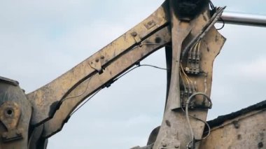 Excavator's parts close-up. The structure of the excavator. Bucket details close-up. 4K