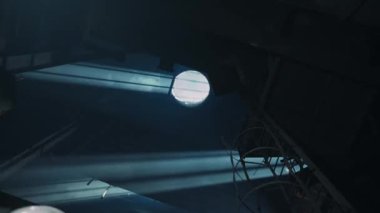 A bright beam of light hits through the window on the ceiling. Steel plant. 4K