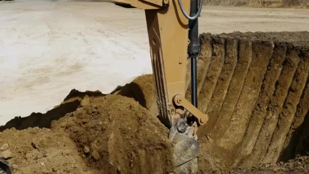 Yellow Crawler Excavator Quarry Picks Pile Sandy Soil Bucket Close — Stock Video