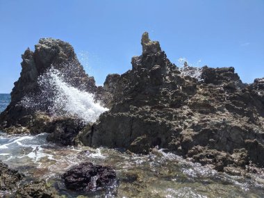 St. Thomas blowhole with waves crashing through