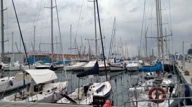 Sailboats in harbor in Genoa Italy