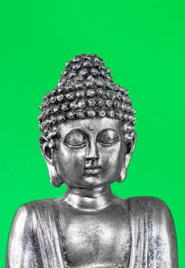 buddha face, green screen. close up