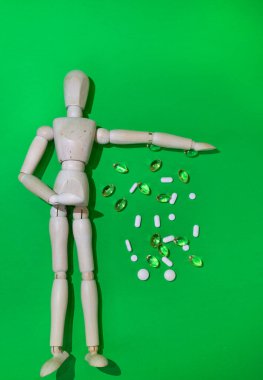 The dangers of Drug overdose concept, symbolized by an anonymous wooden mannequin. green screen 