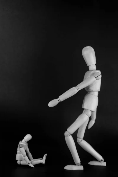 Wooden Mannequin Scolding Another Smaller Mannequin Black Background — Stockfoto