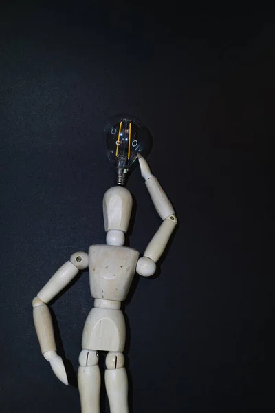 Mannequin Wood Figure Carrying Incandescent Light Bulb New Idea Concept — Stock Fotó