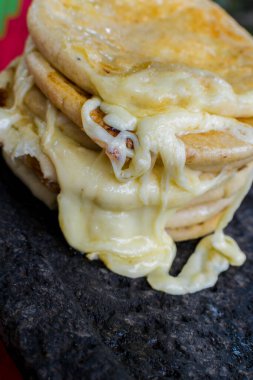 typical Salvadoran dish, cheese pupusas with cabbage and tomato sauce. rice and corn pupusas stuffed with cheese, beans or other ingredients
