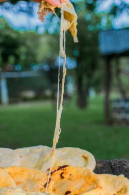 typical Salvadoran dish, cheese pupusas with cabbage and tomato sauce. rice and corn pupusas stuffed with cheese, beans or other ingredients