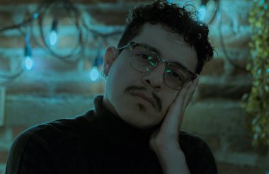 intellectual model with turtleneck shirt and glasses