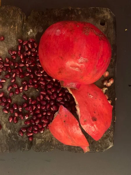 Ripe Pomegranate Leaves Wooden Board Dark Background — Fotografia de Stock