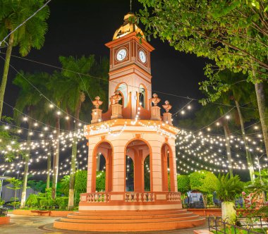 kiosk illuminated at night. ahuachapan central park, el salvador