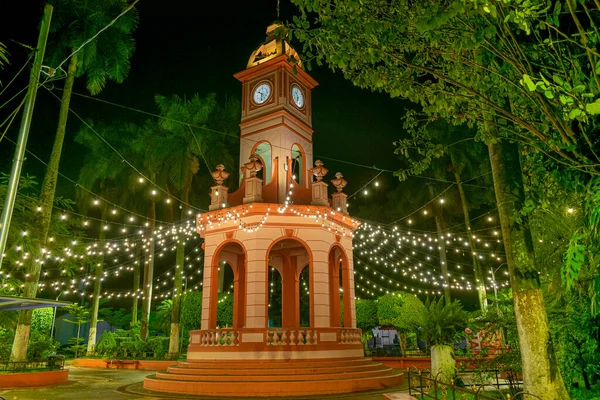 kiosk illuminated at night. ahuachapan central park, el salvador