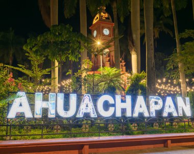 night view of the clock tower in the concordia park located in the city of ahuachapan el salvador central america
