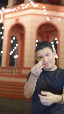 magician doing trick with a coin. disappearing coin