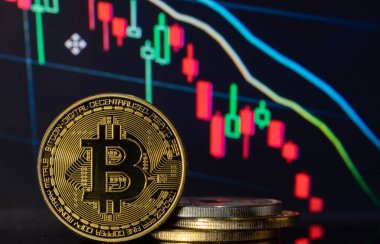 Bitcoin with a blurred background financial charts