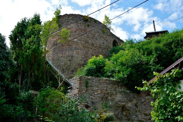 View of the ruins of the round tower of Talmberk from the east from the street below the castle (Czech Republic)