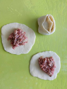 various dough dishes small circles of dough and fillings on the table