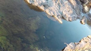video of a small waterfall on the river among the rocks