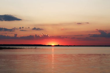 beautiful sunset on beach at sea coast