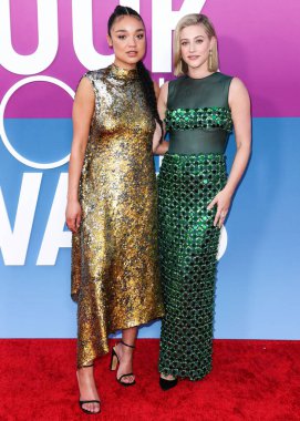 Australian actress Aisha Dee and American actress Lili Reinhart wearing Miu Miu arrive at the Los Angeles Premiere Of Netflix's 'Look Both Ways' held at the Netflix Tudum Theater on August 16, 2022 in Hollywood, Los Angeles, California, United States
