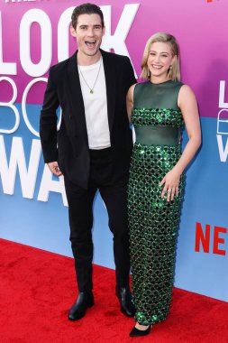 American actor David Corenswet and American actress Lili Reinhart wearing Miu Miu arrive at the Los Angeles Premiere Of Netflix's 'Look Both Ways' held at the Netflix Tudum Theater on August 16, 2022 in Hollywood, Los Angeles, California