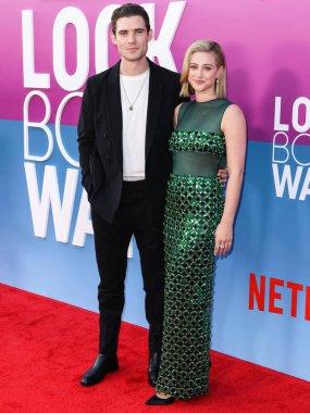 American actor David Corenswet and American actress Lili Reinhart wearing Miu Miu arrive at the Los Angeles Premiere Of Netflix's 'Look Both Ways' held at the Netflix Tudum Theater on August 16, 2022 in Hollywood, Los Angeles, California
