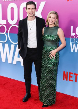 American actor David Corenswet and American actress Lili Reinhart wearing Miu Miu arrive at the Los Angeles Premiere Of Netflix's 'Look Both Ways' held at the Netflix Tudum Theater on August 16, 2022 in Hollywood, Los Angeles, California