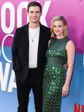 American actor David Corenswet and American actress Lili Reinhart wearing Miu Miu arrive at the Los Angeles Premiere Of Netflix's 'Look Both Ways' held at the Netflix Tudum Theater on August 16, 2022 in Hollywood, Los Angeles, California