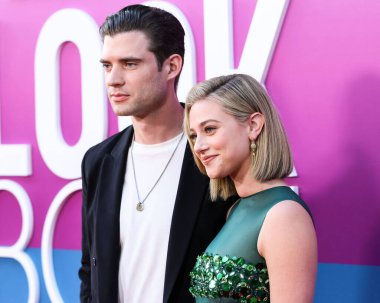 American actor David Corenswet and American actress Lili Reinhart wearing Miu Miu arrive at the Los Angeles Premiere Of Netflix's 'Look Both Ways' held at the Netflix Tudum Theater on August 16, 2022 in Hollywood, Los Angeles, California