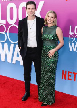 American actor David Corenswet and American actress Lili Reinhart wearing Miu Miu arrive at the Los Angeles Premiere Of Netflix's 'Look Both Ways' held at the Netflix Tudum Theater on August 16, 2022 in Hollywood, Los Angeles, California