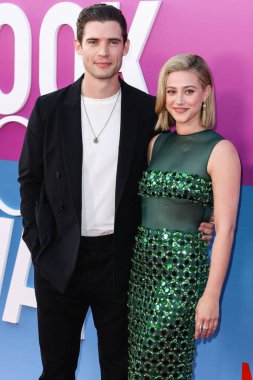 American actor David Corenswet and American actress Lili Reinhart wearing Miu Miu arrive at the Los Angeles Premiere Of Netflix's 'Look Both Ways' held at the Netflix Tudum Theater on August 16, 2022 in Hollywood, Los Angeles, California