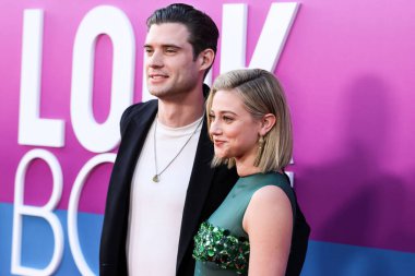 American actor David Corenswet and American actress Lili Reinhart wearing Miu Miu arrive at the Los Angeles Premiere Of Netflix's 'Look Both Ways' held at the Netflix Tudum Theater on August 16, 2022 in Hollywood, Los Angeles, California