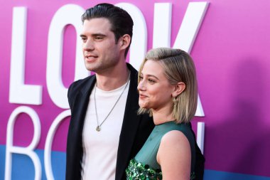 American actor David Corenswet and American actress Lili Reinhart wearing Miu Miu arrive at the Los Angeles Premiere Of Netflix's 'Look Both Ways' held at the Netflix Tudum Theater on August 16, 2022 in Hollywood, Los Angeles, California