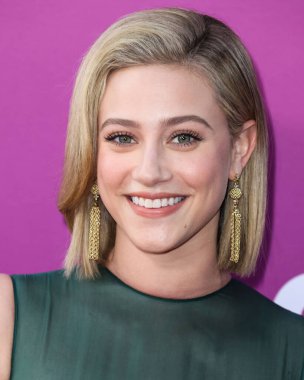 American actress Lili Reinhart wearing Miu Miu arrives at the Los Angeles Premiere Of Netflix's 'Look Both Ways' held at the Netflix Tudum Theater on August 16, 2022 in Hollywood, Los Angeles, California, United States. 