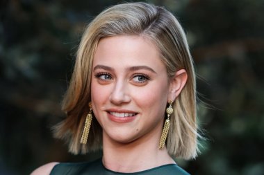 American actress Lili Reinhart wearing Miu Miu arrives at the Los Angeles Premiere Of Netflix's 'Look Both Ways' held at the Netflix Tudum Theater on August 16, 2022 in Hollywood, Los Angeles, California, United States. 