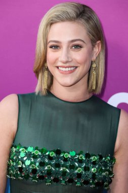 American actress Lili Reinhart wearing Miu Miu arrives at the Los Angeles Premiere Of Netflix's 'Look Both Ways' held at the Netflix Tudum Theater on August 16, 2022 in Hollywood, Los Angeles, California, United States. 