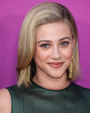 American actress Lili Reinhart wearing Miu Miu arrives at the Los Angeles Premiere Of Netflix's 'Look Both Ways' held at the Netflix Tudum Theater on August 16, 2022 in Hollywood, Los Angeles, California, United States. 