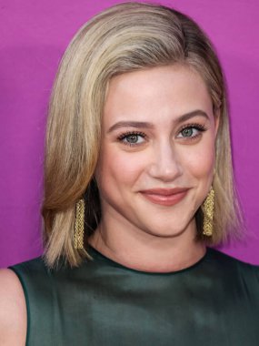 American actress Lili Reinhart wearing Miu Miu arrives at the Los Angeles Premiere Of Netflix's 'Look Both Ways' held at the Netflix Tudum Theater on August 16, 2022 in Hollywood, Los Angeles, California, United States. 
