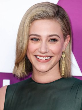 American actress Lili Reinhart wearing Miu Miu arrives at the Los Angeles Premiere Of Netflix's 'Look Both Ways' held at the Netflix Tudum Theater on August 16, 2022 in Hollywood, Los Angeles, California, United States. 