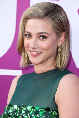 American actress Lili Reinhart wearing Miu Miu arrives at the Los Angeles Premiere Of Netflix's 'Look Both Ways' held at the Netflix Tudum Theater on August 16, 2022 in Hollywood, Los Angeles, California, United States. 