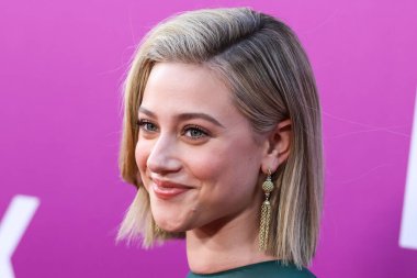 American actress Lili Reinhart wearing Miu Miu arrives at the Los Angeles Premiere Of Netflix's 'Look Both Ways' held at the Netflix Tudum Theater on August 16, 2022 in Hollywood, Los Angeles, California, United States. 