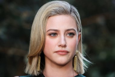 American actress Lili Reinhart wearing Miu Miu arrives at the Los Angeles Premiere Of Netflix's 'Look Both Ways' held at the Netflix Tudum Theater on August 16, 2022 in Hollywood, Los Angeles, California, United States. 